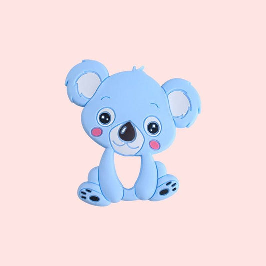 cute cartoon koala teether, with large eyes and friendly expression The koala has blue fur with darker patches around the eyes, inner ears, and limbs. It features a prominent black nose and rosy cheeks, perfect for children’s educational materials about wildlife or Australian animals